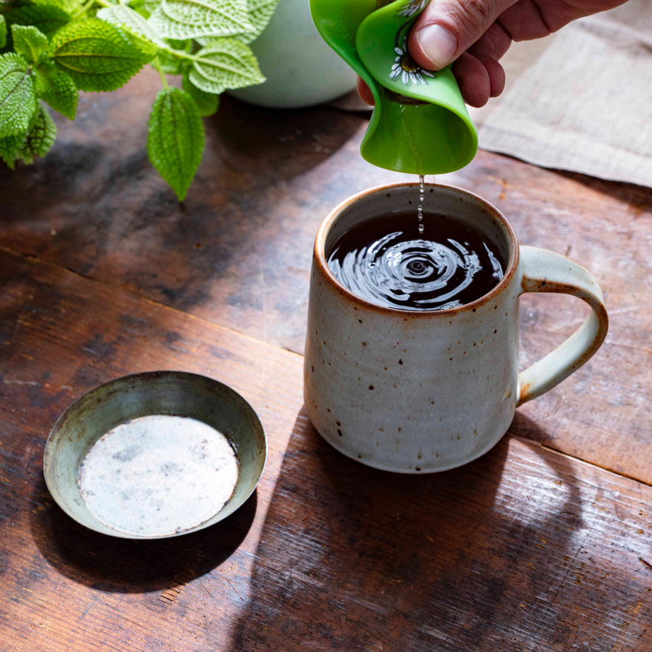 Gas Relief™ Tea with tea buddy squeezing tea bag on top View 2