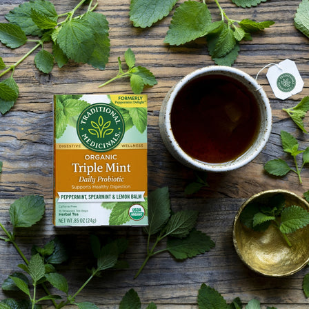 Triple Mint Tea with a cup of tea and mint at the background